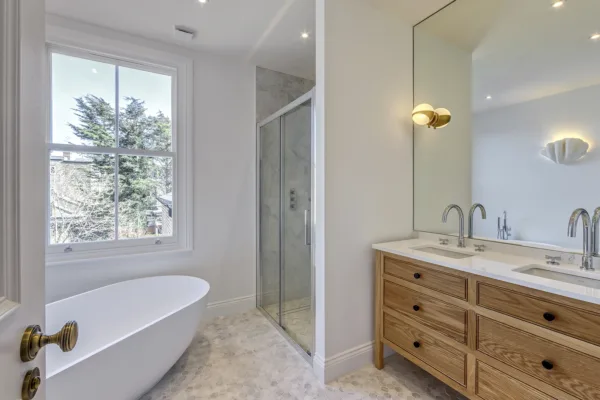 Modern refurbished bathroom with contemporary fixtures and tiling.