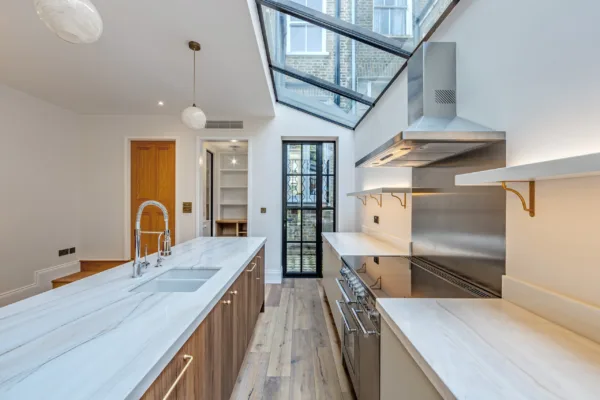 Contemporary kitchen design featuring custom cabinetry and appliances